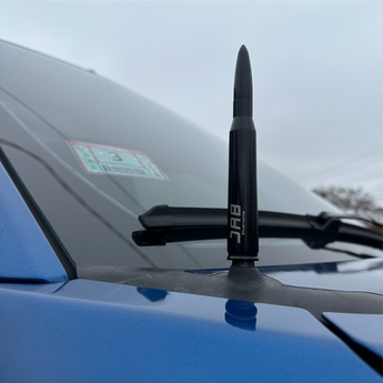 black 50 cal antenna on blue truck