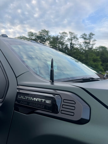 black 50 cal antenna on green duramax