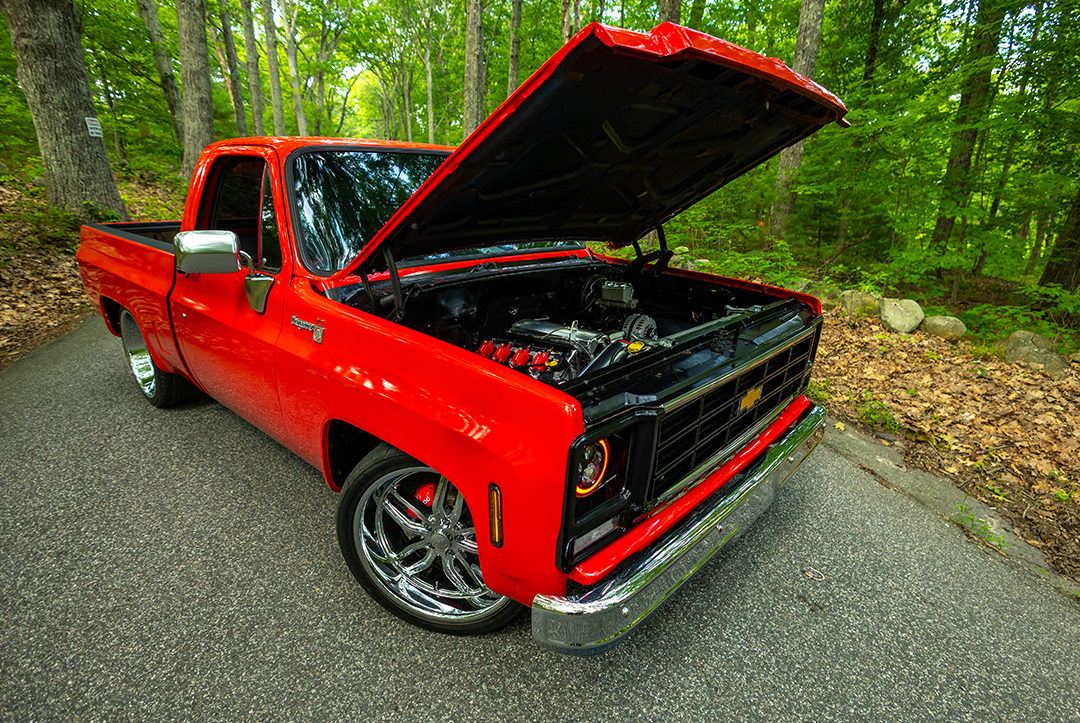 Red C10 pickup with open hood