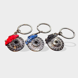 Brake caliper and rotor key chains in red, blue and black