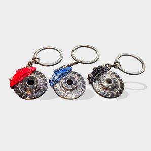 Brake caliper and rotor key chains in red, blue and black