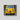 JRB7 custom yellow mini truck canvas on a dirt road with greenery in the background