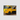 JRB7 custom yellow mini truck canvas with an open bed carrying a large log in a forest setting