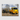 JRB7 custom yellow mini truck canvas with a trailer on a grassy field with trees in the background