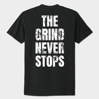 Black t-shirt with 'The Grind Never Stops' text on a white background