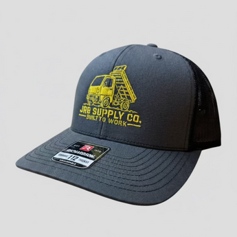 JRB7 gray and black cap with yellow dump truck graphic and JRB Supply Co text on a white background