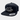 Black snapback cap with white logo on a light gray background