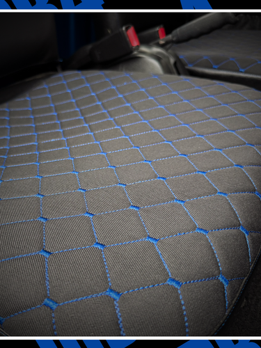 Three views of a car interior with blue stitching on gray seats.
