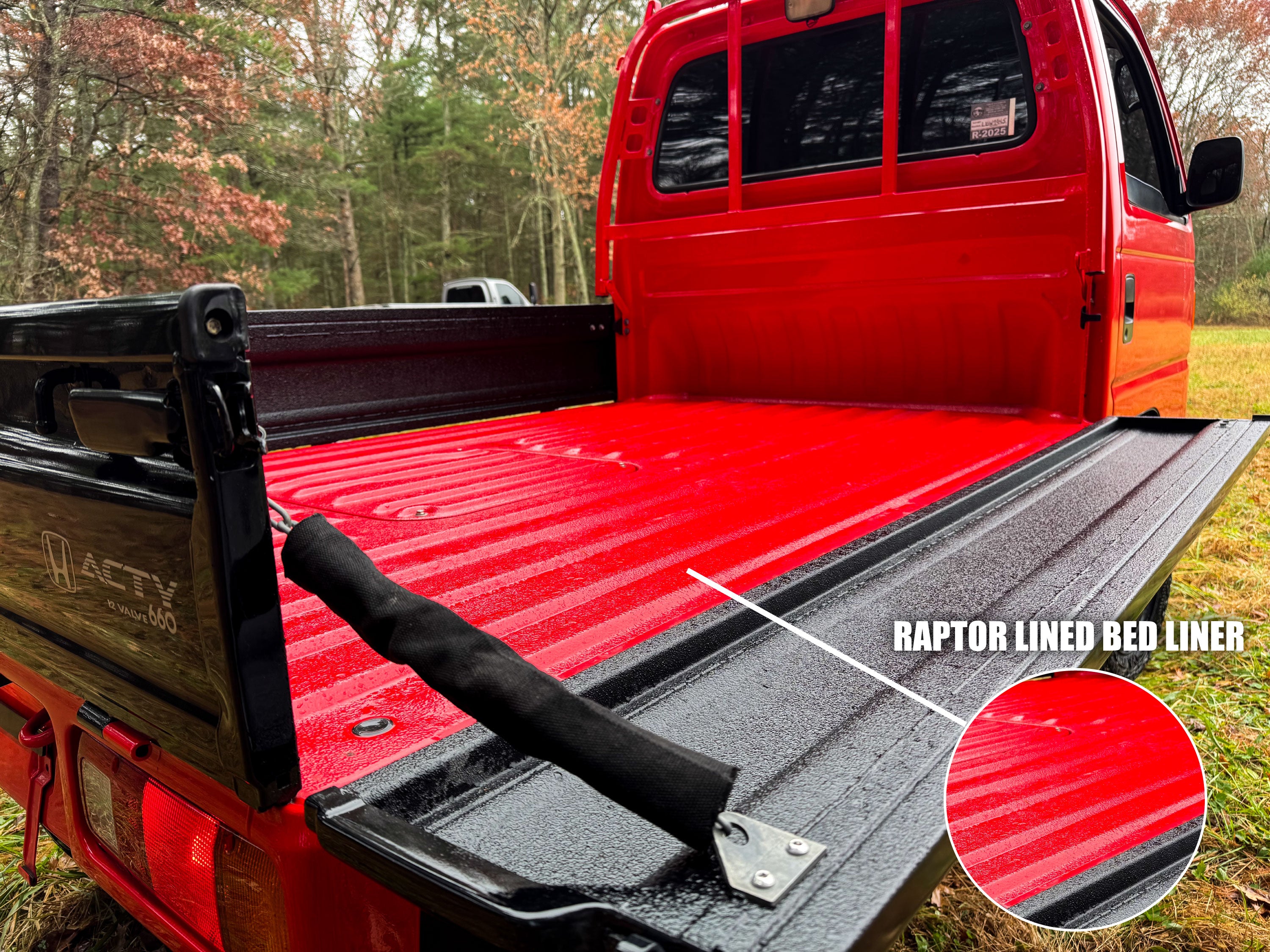 Red truck with a red bed liner in an outdoor setting
