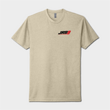 A light heather beige crewneck t-shirt featuring a small 'JRB' logo printed on the left chest in black and red, displayed against a neutral light gray background.