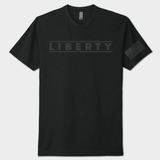 Black on black t-shirt with 'LIBERTY' text and a flag patch on a white background