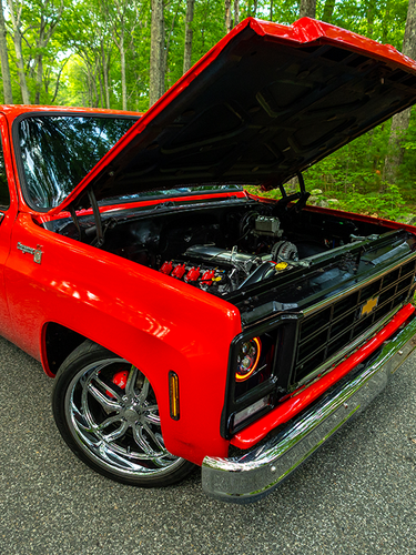 Red C10 pickup with open hood