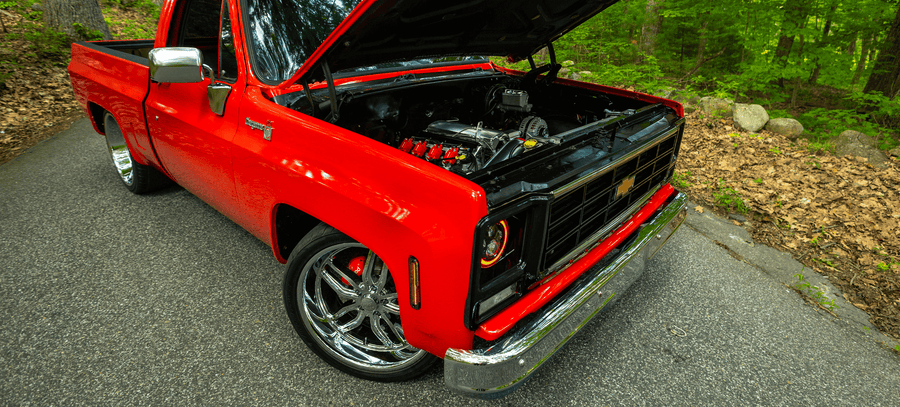 Red C10 pickup with open hood
