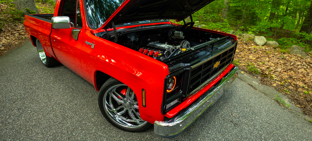 Red C10 pickup with open hood
